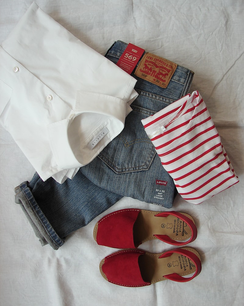 A flat-lay of new-season separates on warm linen