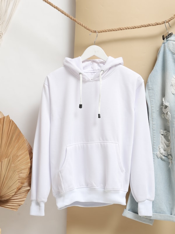 Crisp white oxford dress shirt on a hanger