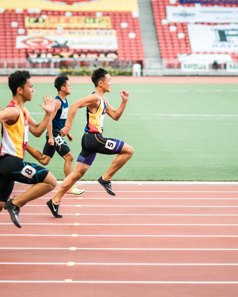 Sprinters powering down a stadium track