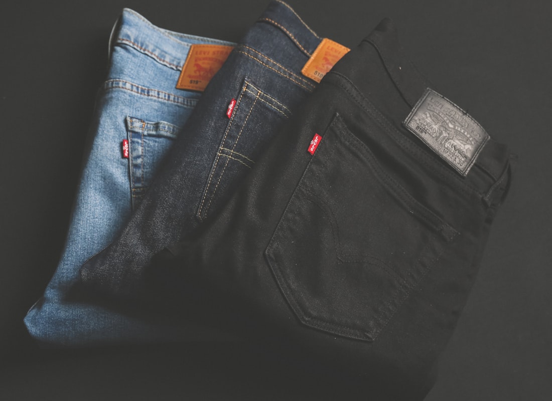 Close-up of heavyweight Ironloom selvedge denim with copper rivets and chainstitch detail