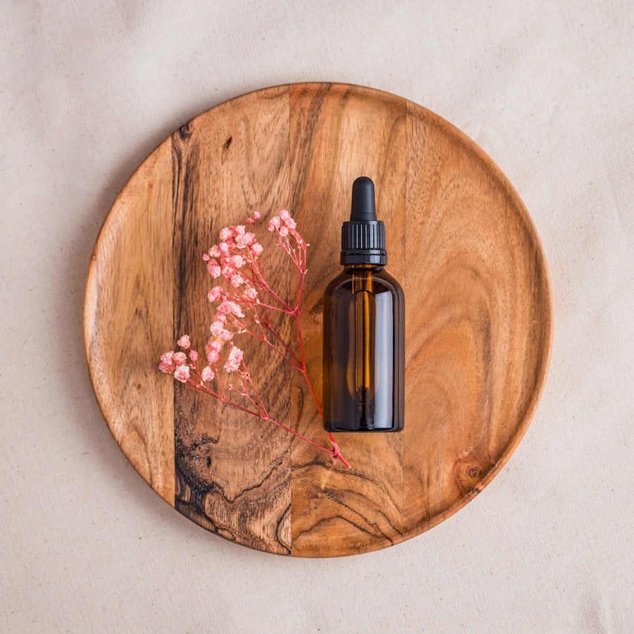Rosehip facial oil in an amber dropper bottle on a wooden dish