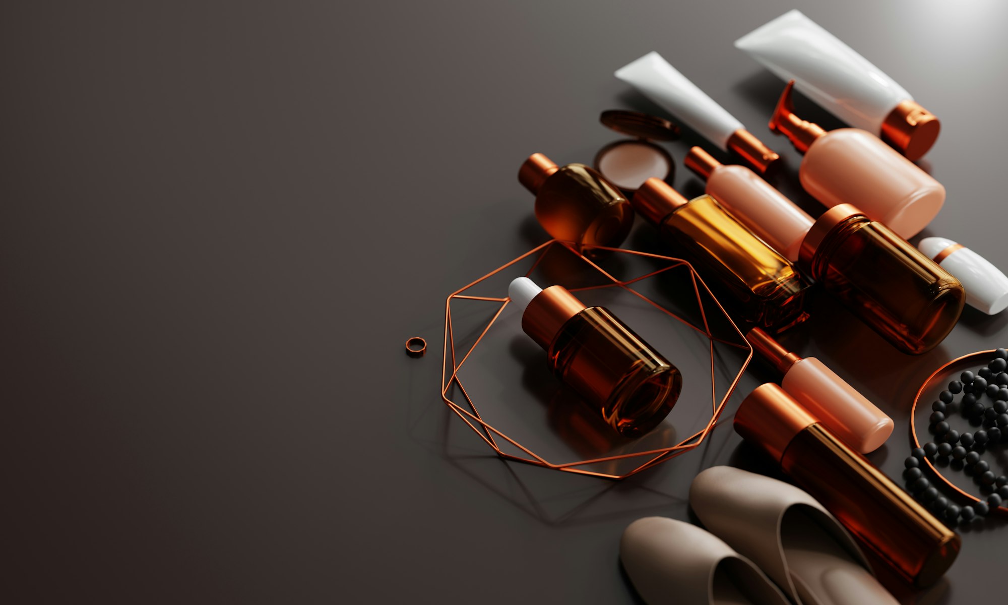 Amber glass fragrance bottles on a dark surface, lit low