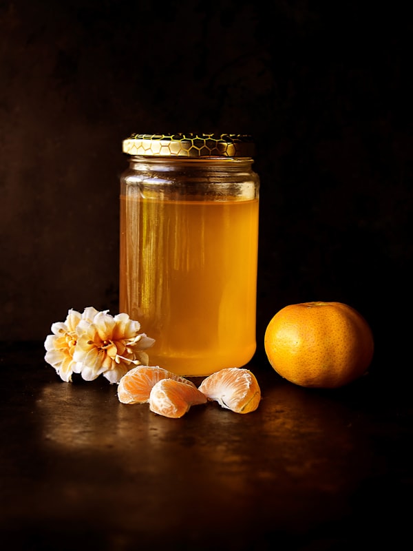Amber honey glowing on a dark table