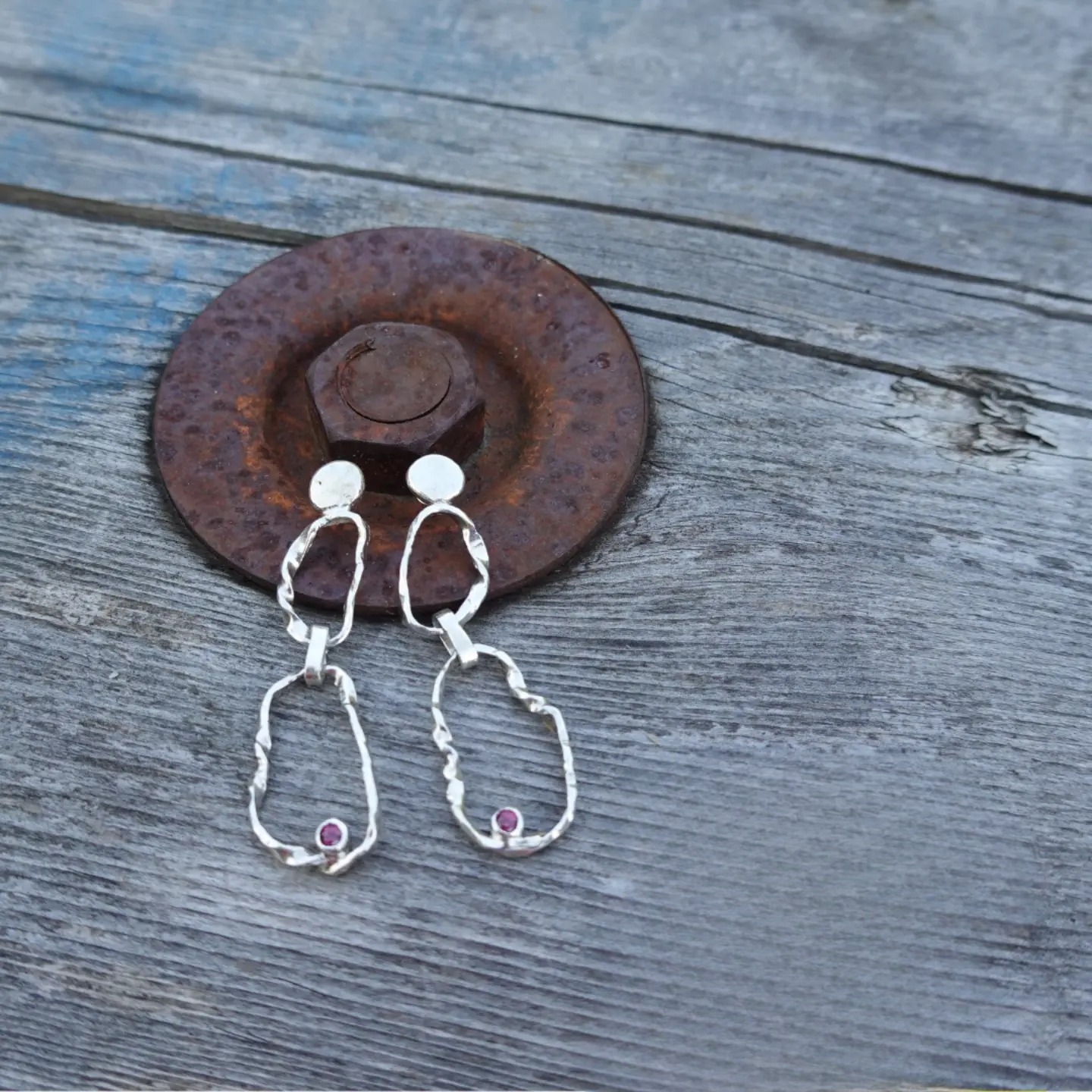 Zora Pearl Drop Earrings on rusted iron