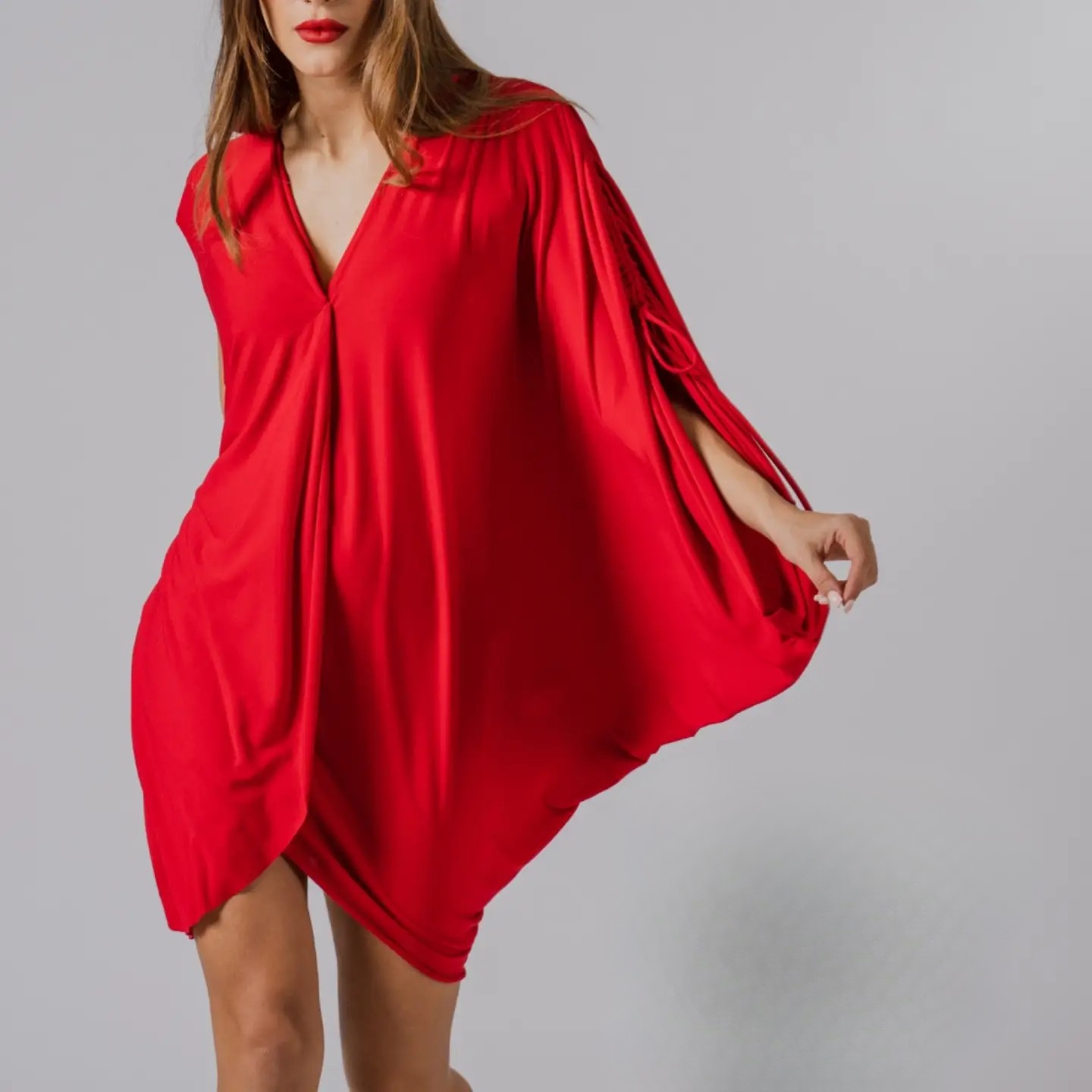 The Lela flow dress in red, studio photograph