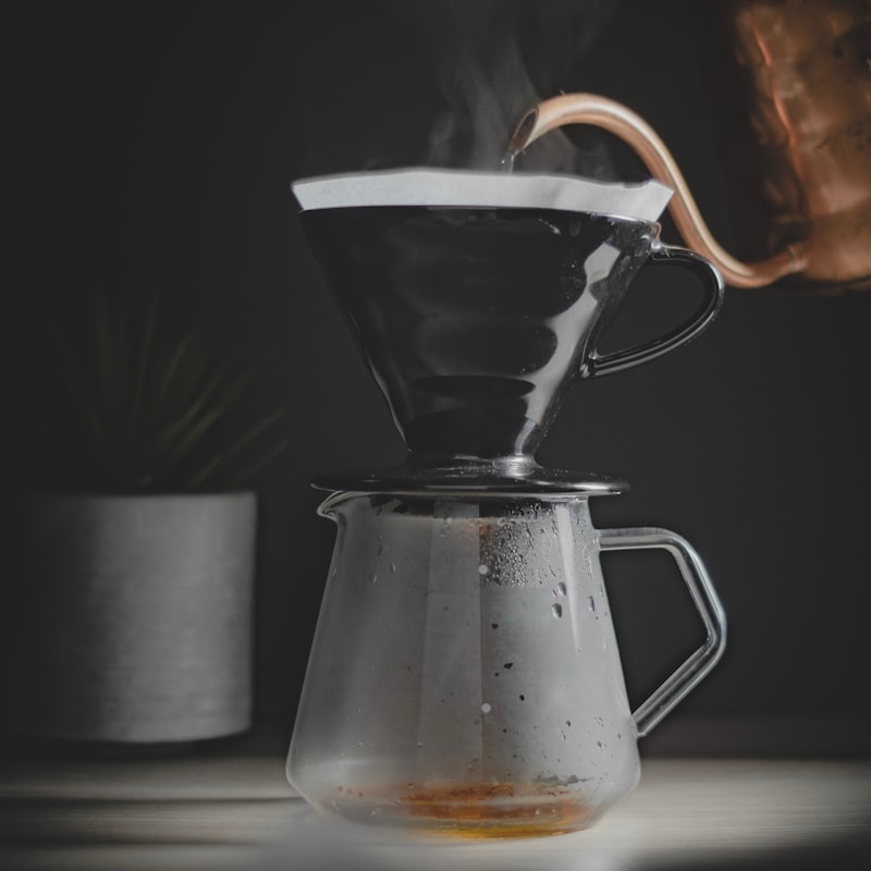 Pour-over coffee dripping through a glass dripper