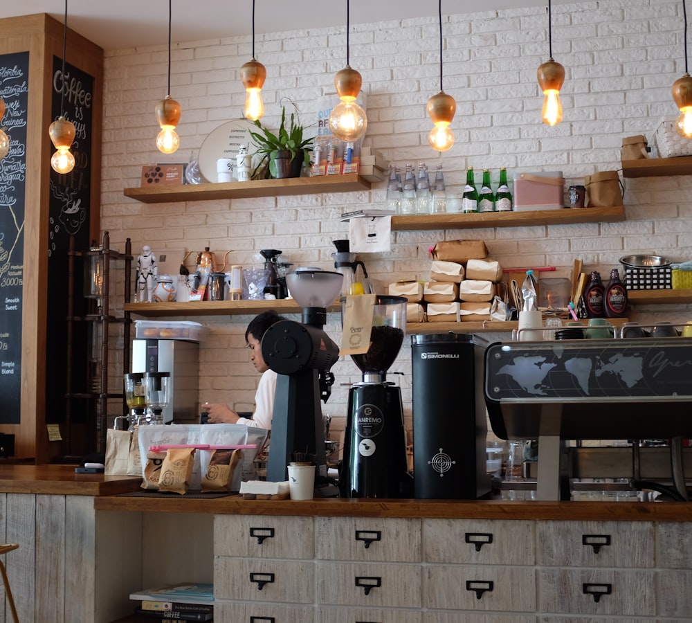 Sunlit interior of Kindred Coffee with timber counter and hanging plants