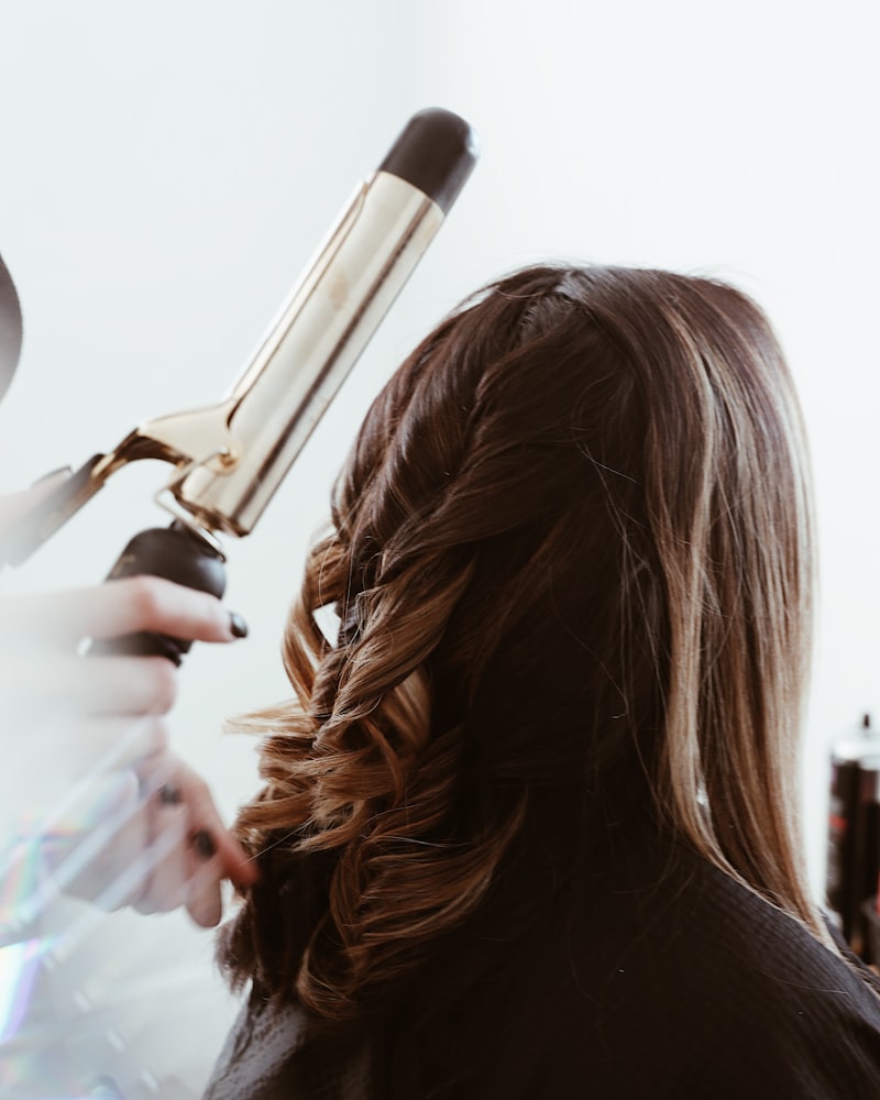 Soft caramel balayage styled in loose, glossy waves