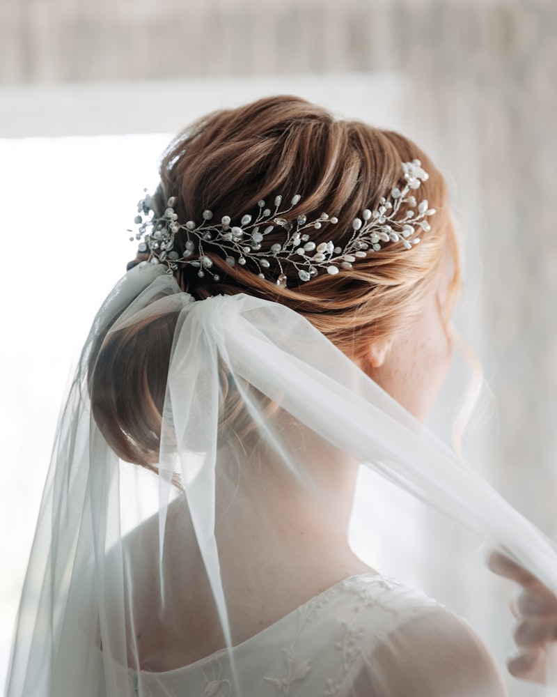 Romantic occasion updo with soft tendrils