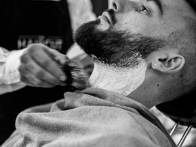 Hot-towel shave in progress at the chair