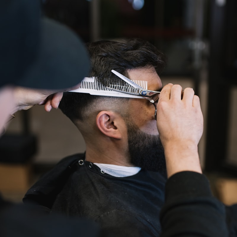 Classic side-part cut styled with matte pomade