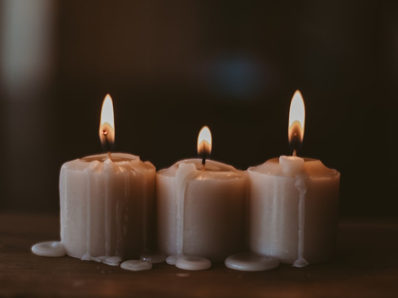Candles, smooth stones and a tea tray prepared for a half-day spa ritual