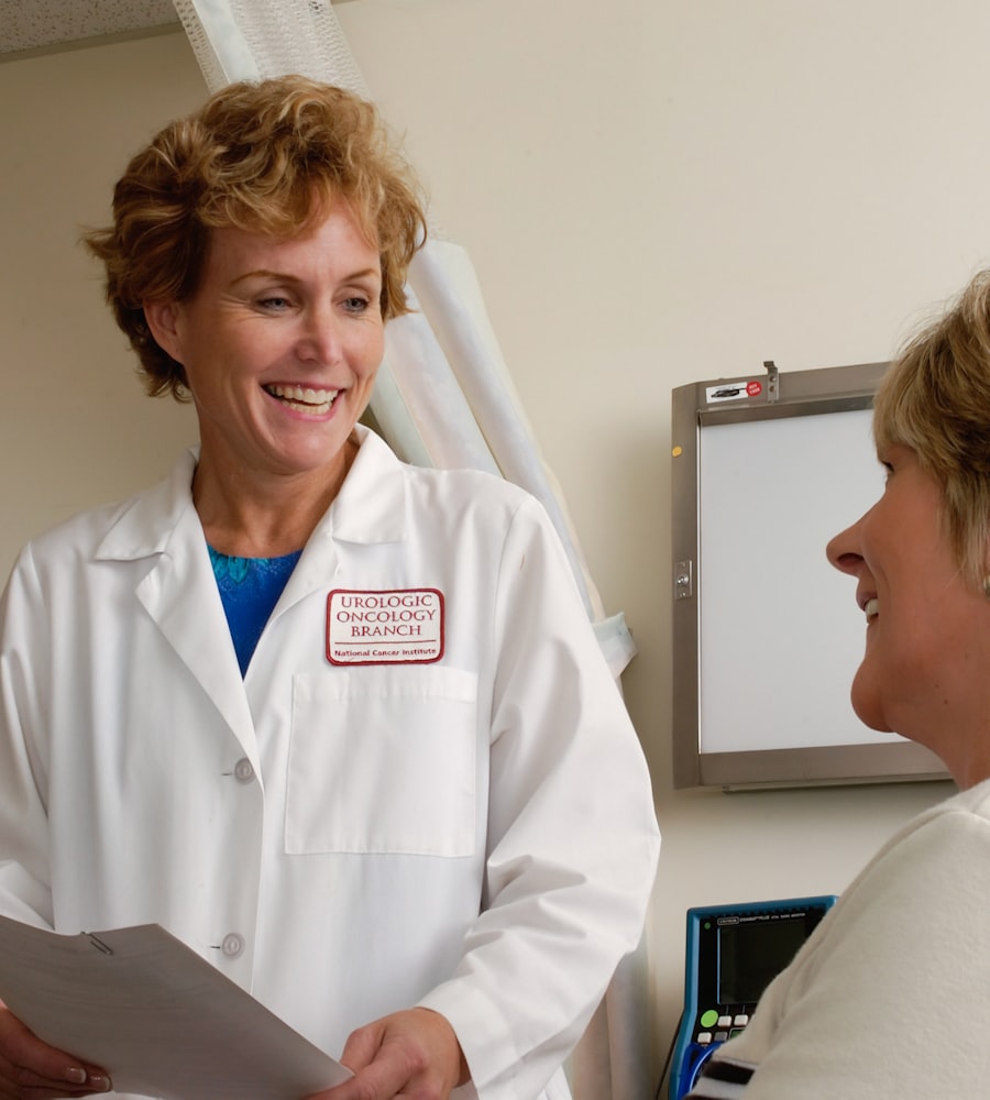 A Cedarwood physician listening attentively to a patient in a bright exam room