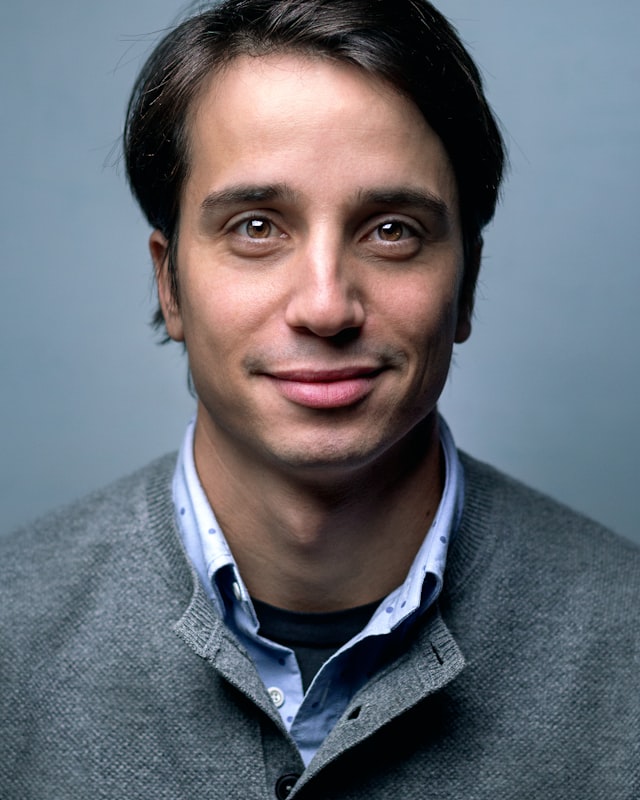 Julian Okafor, Wealth Advisor, in a grey sweater