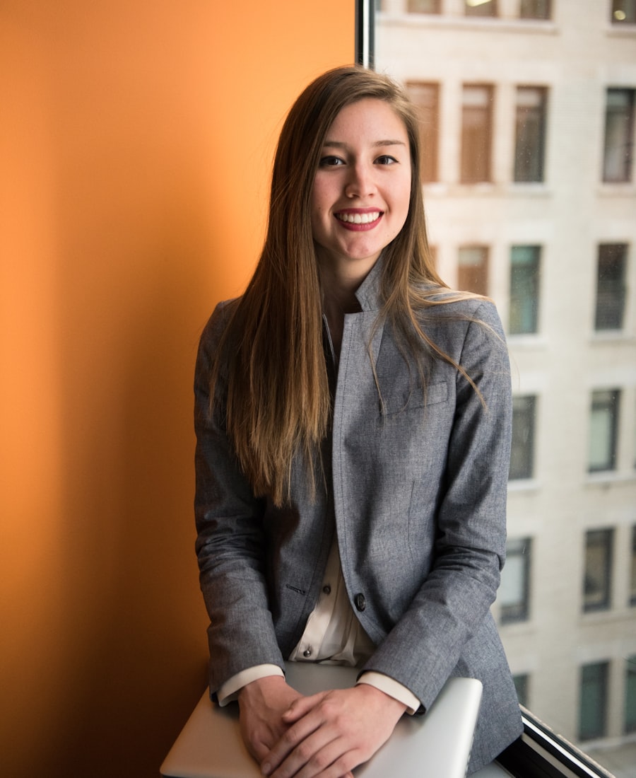 Mara Okafor, SaaS growth consultant, smiling in a grey blazer by an office window