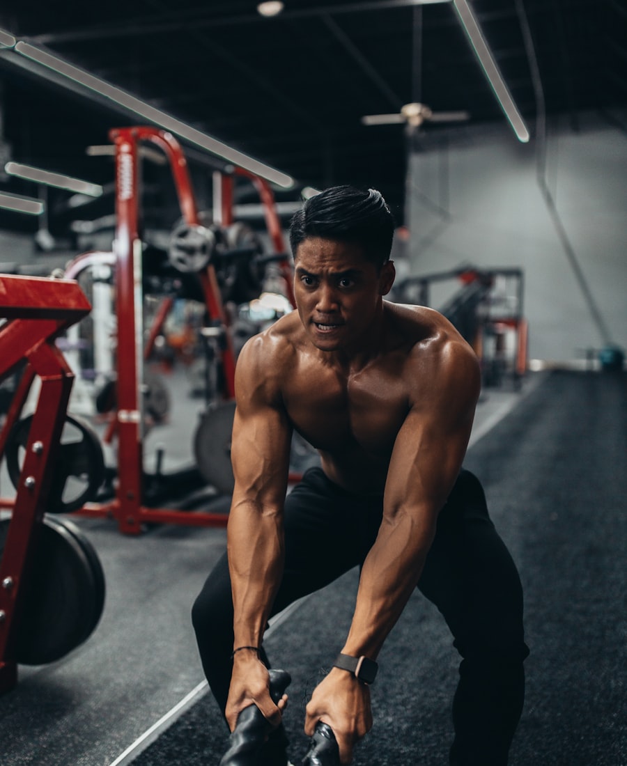 Coach Marcus Hale mid-workout with battle ropes in the studio