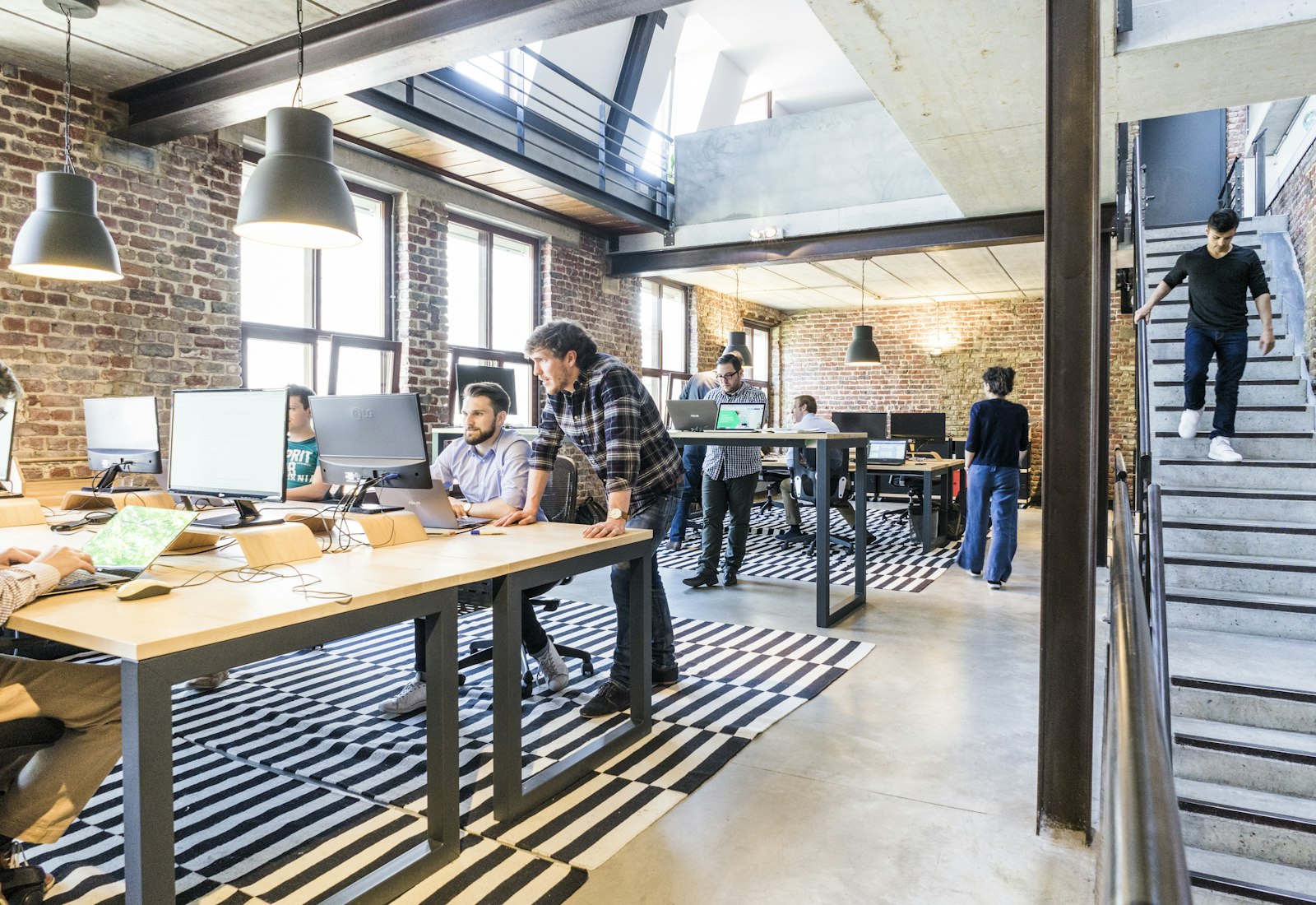 Risefold's open-plan studio with the team working at long shared desks