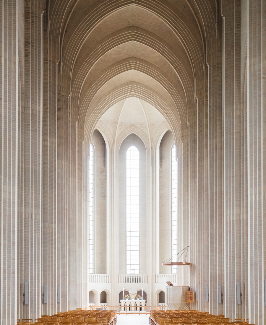 Bright cathedral interior with soaring arches and warm wooden pews