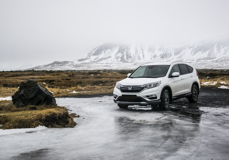 White 2021 Honda CR-V SUV parked near a snow-capped mountain
