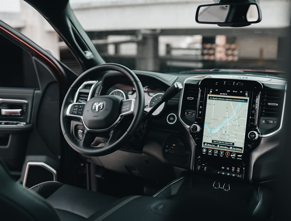 Premium car interior with leather seats and a large infotainment display