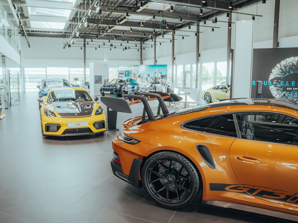 Bright modern Summit Motors showroom with several cars on display
