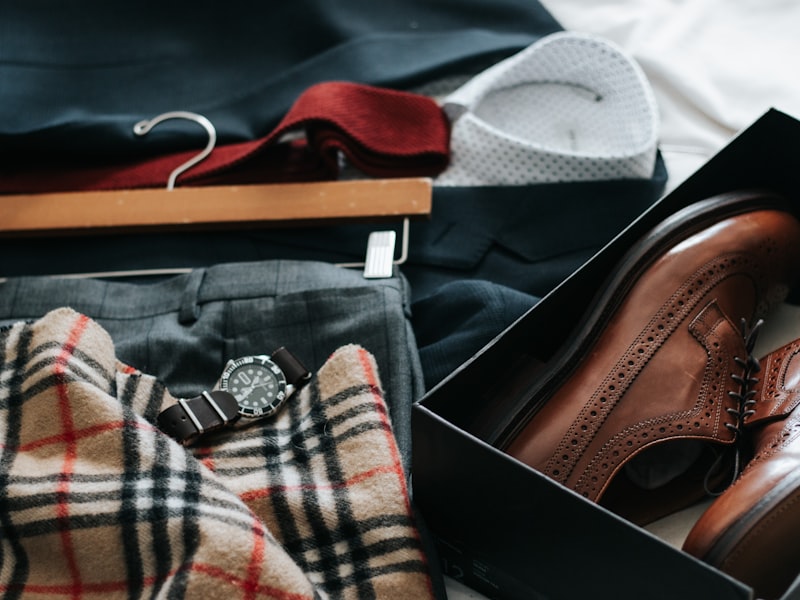 A camel trench coat and tan handbag styled together on a rail