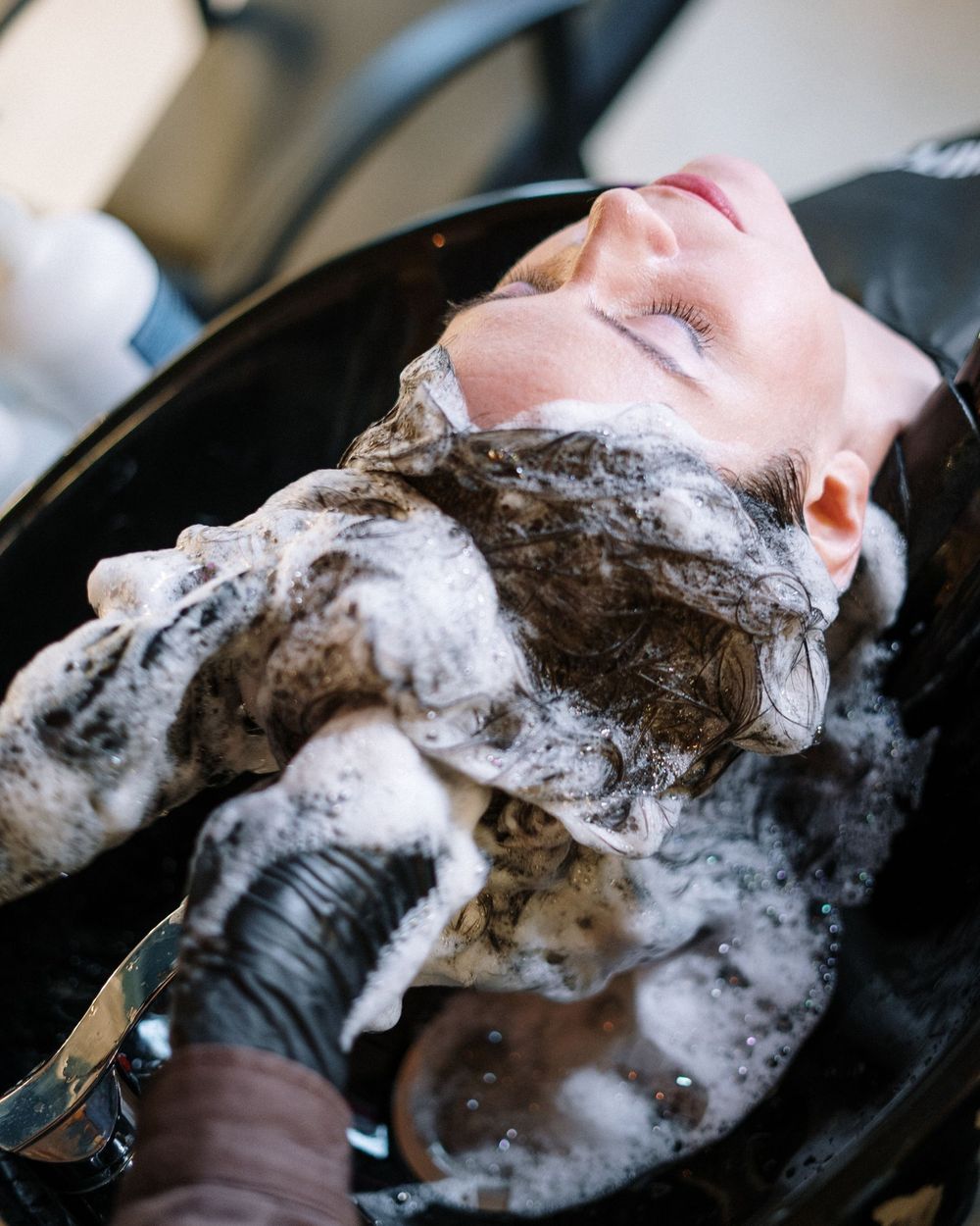 Hair in rich foam during a backwash treatment