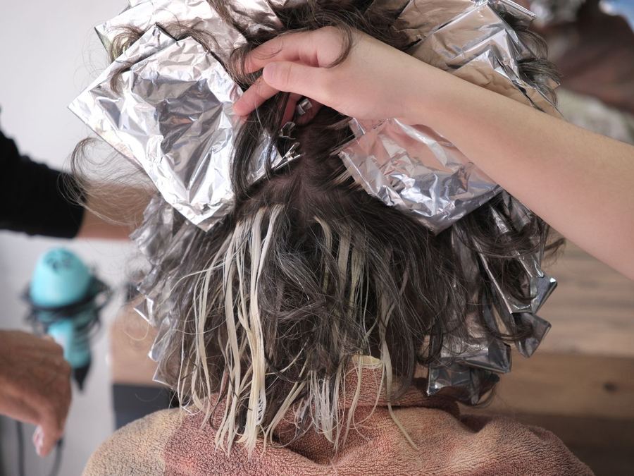 Foils folded through hair mid-process
