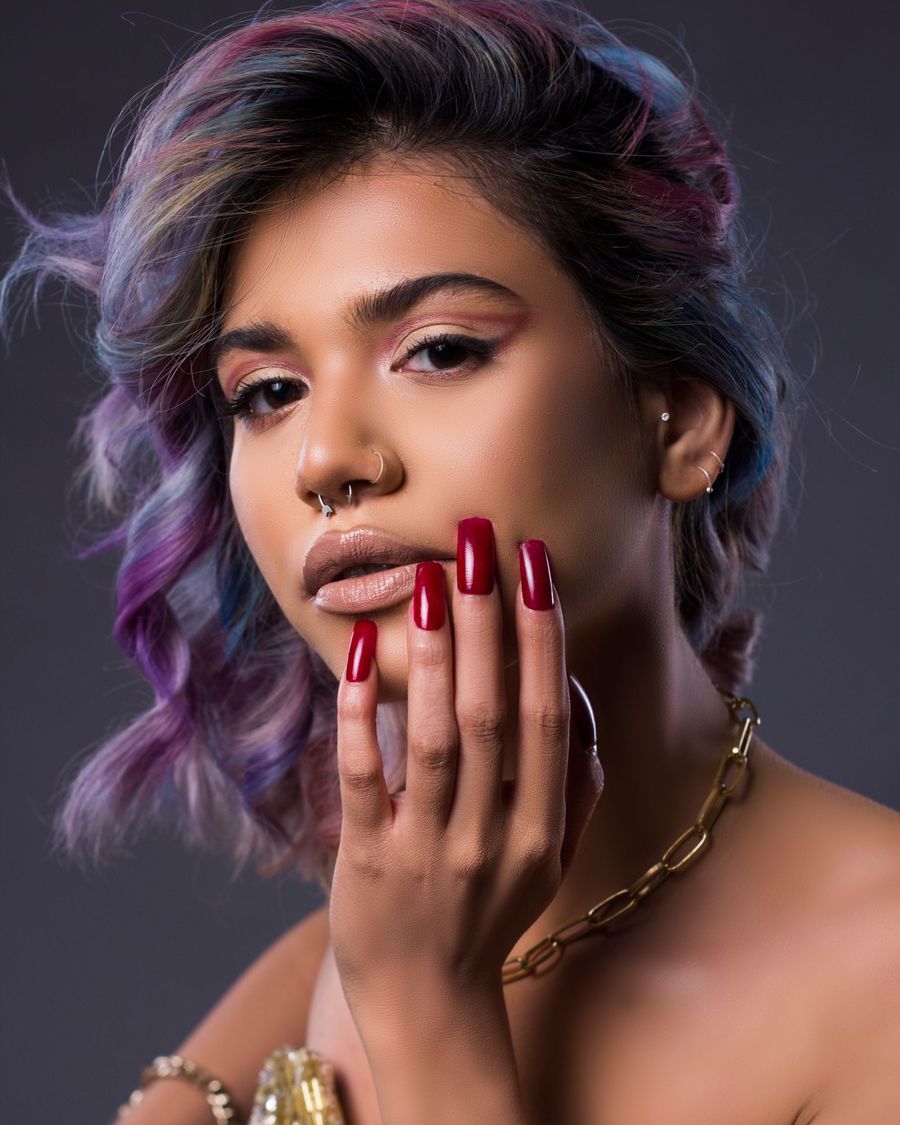 Nika with lilac hair and cherry red nails