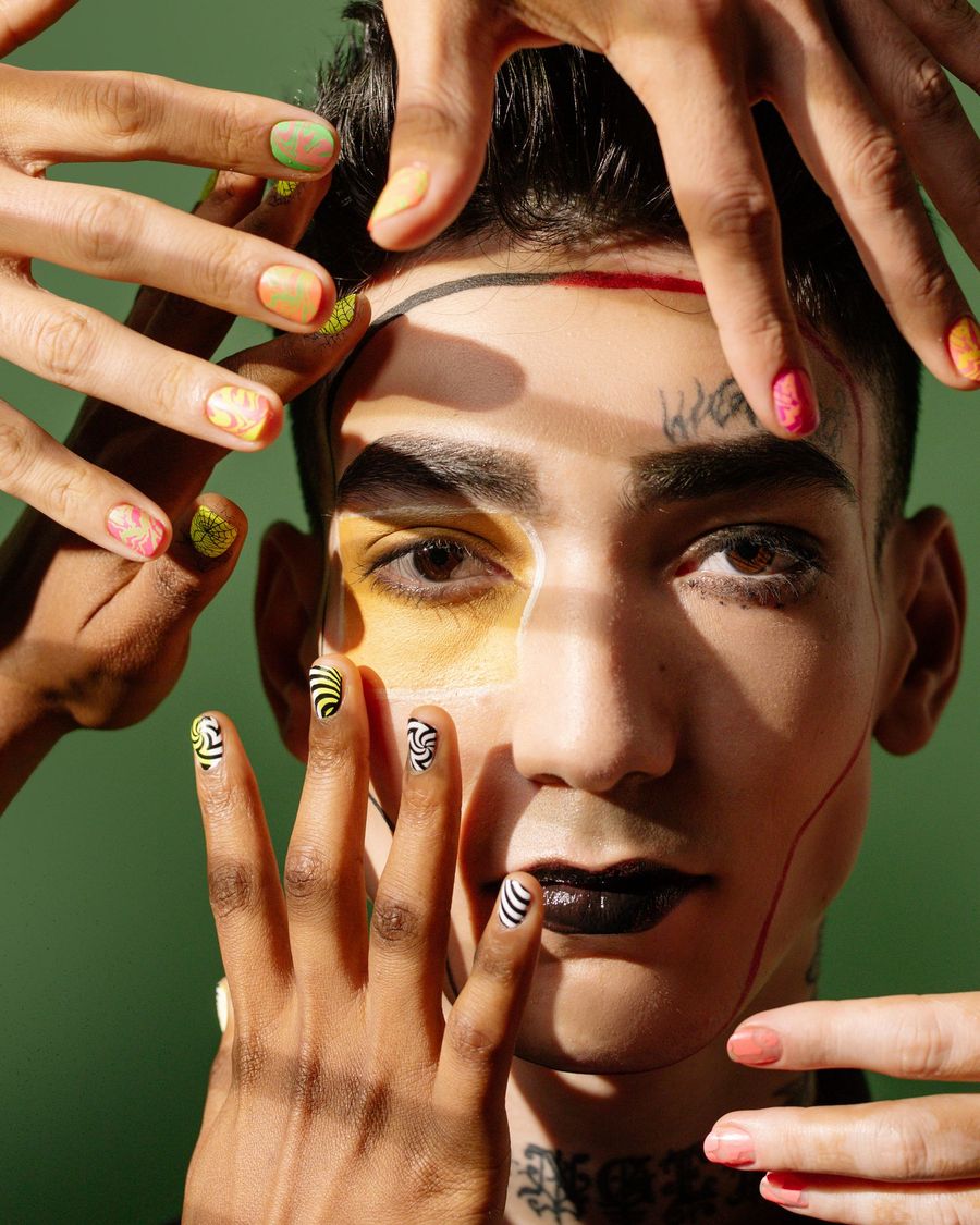 Ema surrounded by hands with colourful mini nail art