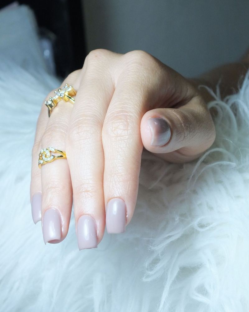 Milky white square nails on faux fur