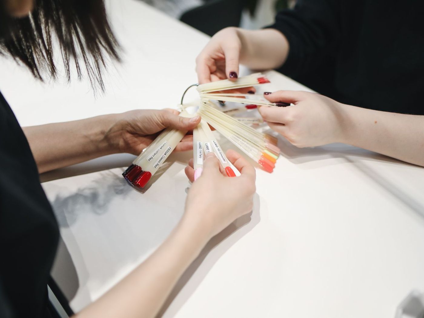 A manicure in progress at a bright studio table