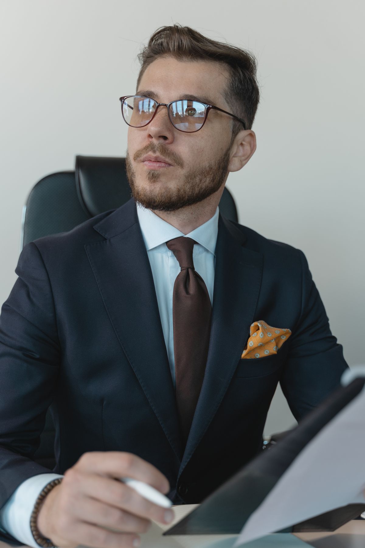 David Novak with glasses, reviewing a document