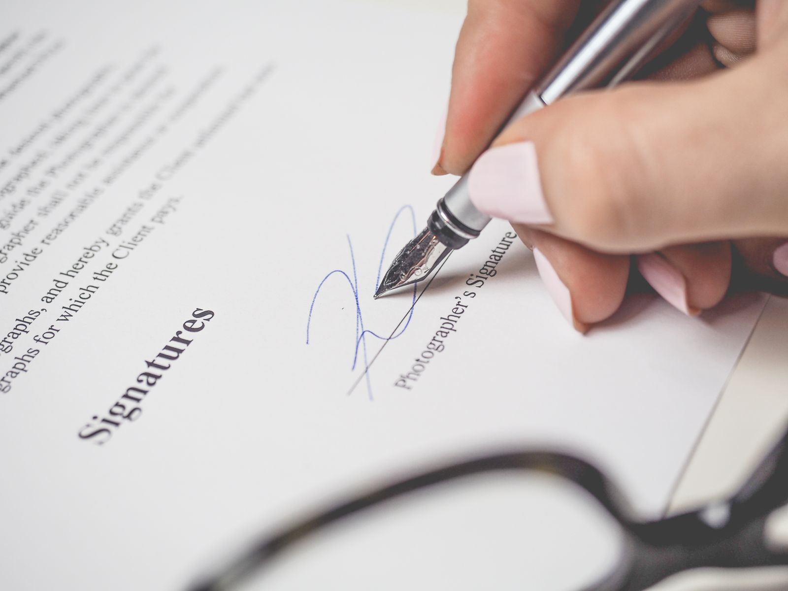 Fountain pen signing an agreement