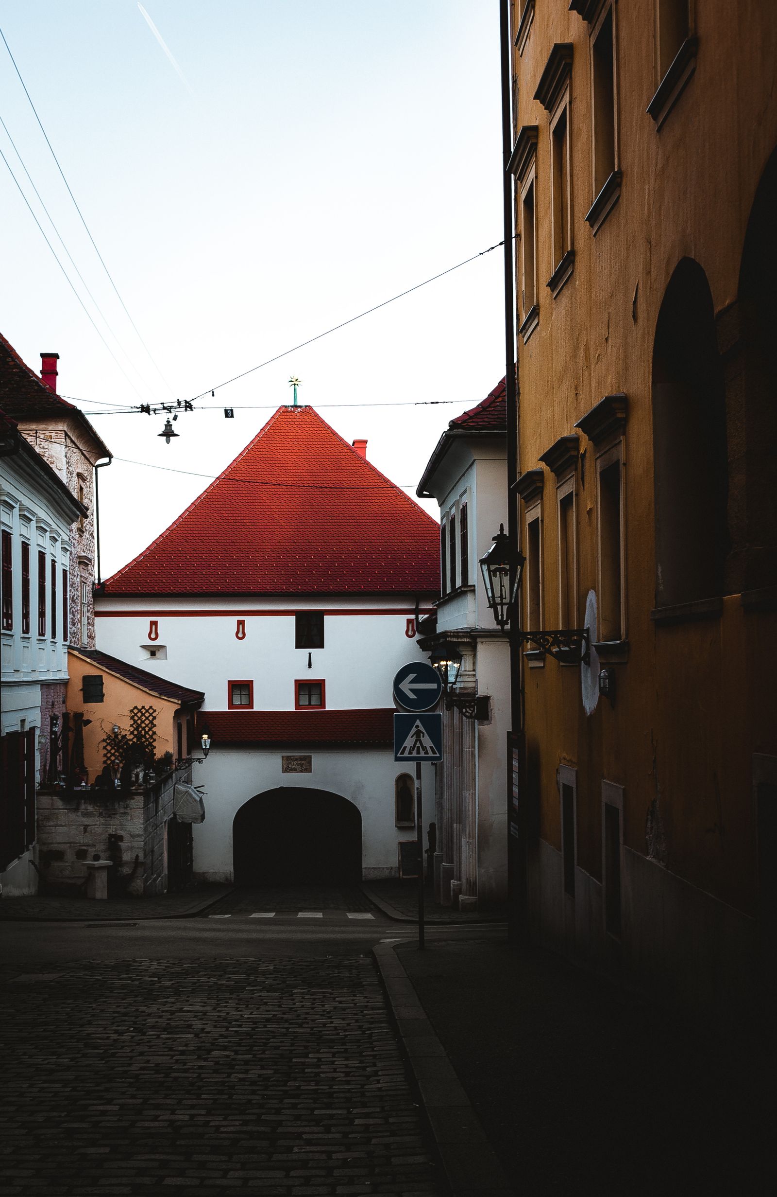 Lantern-lit street facade in the Upper Town