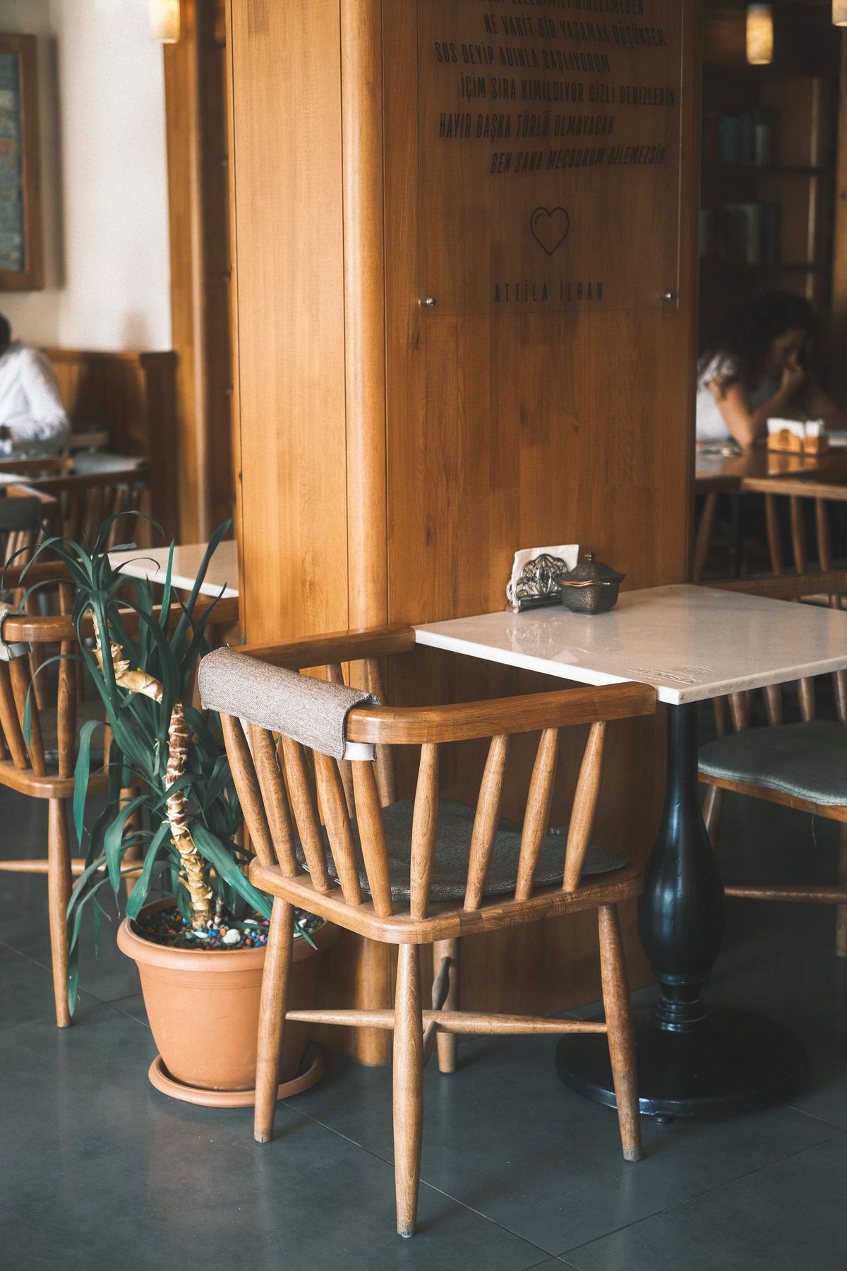 Corner of the dining room with a single chair and soft daylight