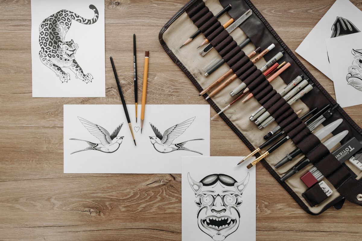 Flash sheet: leaping panther drawing beside pens
